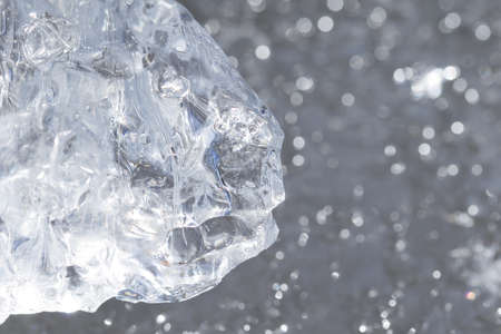 A shiny piece of ice with reflections of light. Diamond-like structureの写真素材
