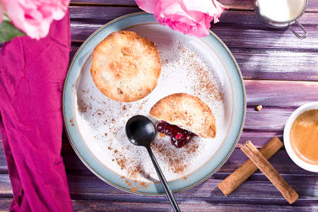 crispy cupcakes filled with fruit and topped with vanilla sauce