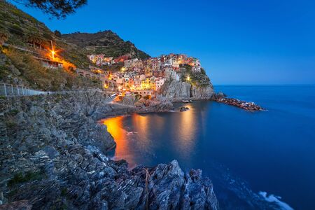 Manarola town on the coast of Ligurian Sea at night, Italyの写真素材