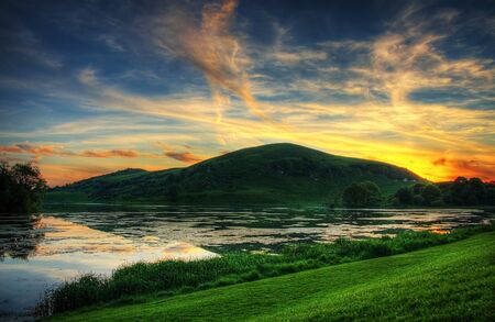 Sunset over Lough Gur lake in Irelandの写真素材