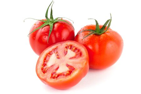 Fresh juicy tomatoes over white backgroundの写真素材
