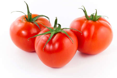 Fresh juicy tomatoes over white backgroundの写真素材