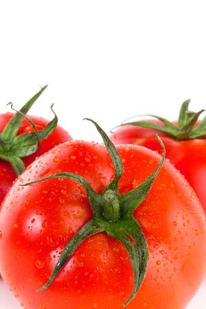Fresh juicy tomatoes over white backgroundの写真素材
