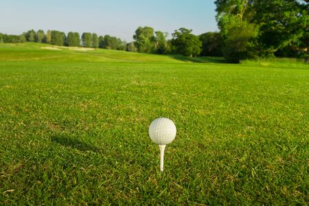 Golf ball on the teeの写真素材