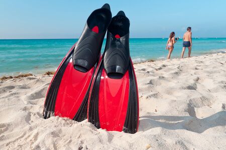 Red flippers at the Caribbean Seaの写真素材