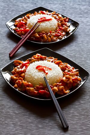 Chinese dish with szechuan chicken and riceの写真素材