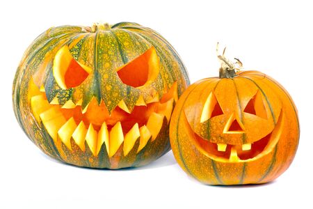 Halloween pumpkins with scary faces over white backgroundの写真素材