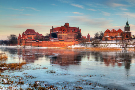 Teutonic castle in Malbork with reflection in frozen Nogat river, Polandのeditorial素材