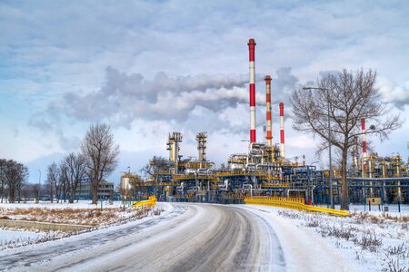 Chimneys of Polish oil refinery in Gdansk during frosty winterの写真素材