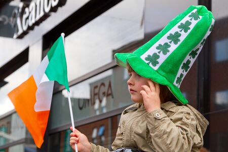 Child with an Irish hat participates in a parade for St. Patrick's Dayのeditorial素材