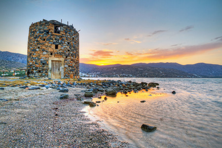 Old windmill ruin at Mirabello Bay on Crete, Greeceの写真素材