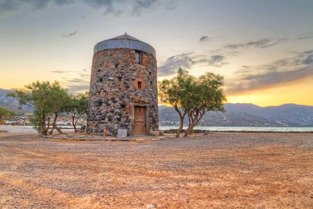 Old windmill ruin at Mirabello Bay on Crete, Greeceの写真素材