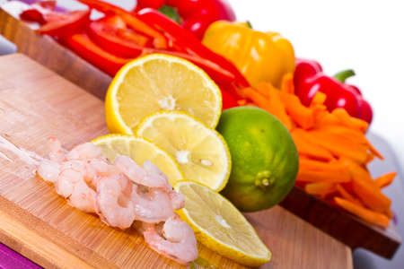 Raw prawns with vegetables for cookingの写真素材