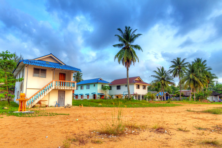 Holiday houses on stilts at sunrise, Thailandの写真素材