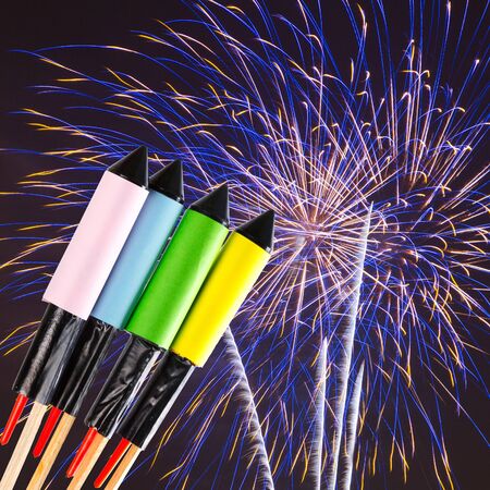 Fireworks over dark sky with explosionsの写真素材