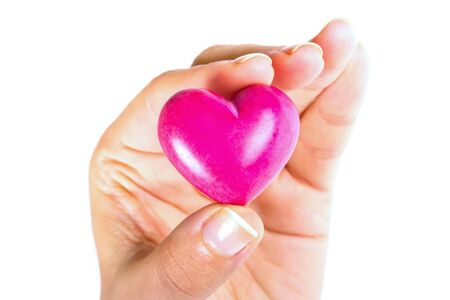 Heart in hand as love and health symbolの写真素材