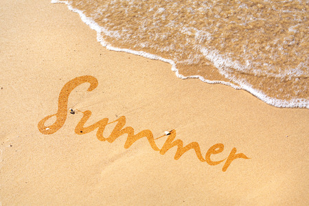 Summer word written on the beachの写真素材