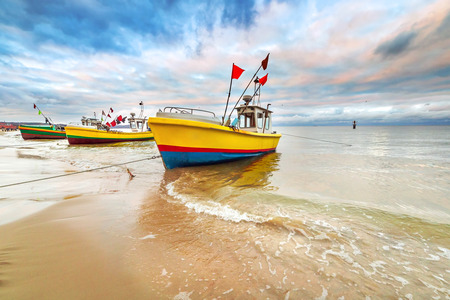 Fishing boats on the beach of Baltic Sea in Polandの写真素材