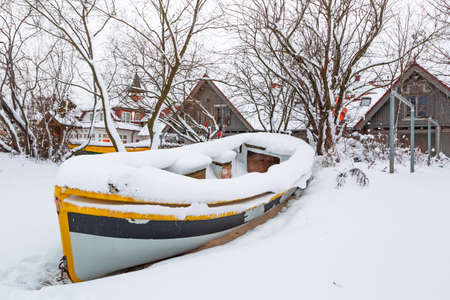 Winter scenery of fishing boat at Baltic Sea in Polandの写真素材