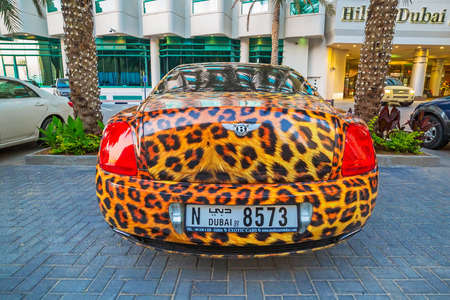 Panther paint Bentley parked outside the Hilton Dubai Hotelのeditorial素材