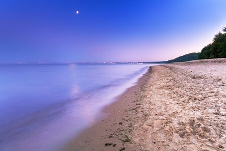 Full moon at Baltic sea beach, Polandの写真素材