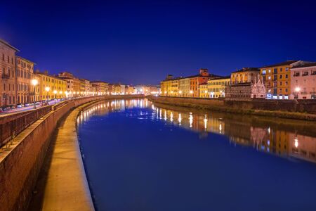 City center of Pisa with reflection in Arno river, Italyの写真素材