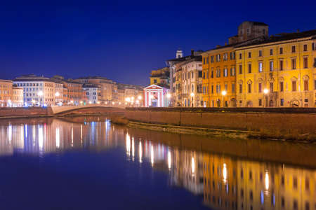 City center of Pisa with reflection in Arno river, Italyの写真素材