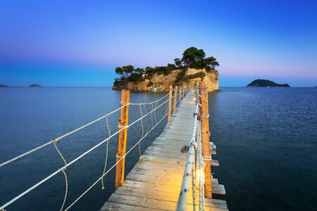 Hanging bridge to the island at night, Zakhynthos in Greeceの写真素材