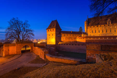 The Castle of the Teutonic Order in Malbork at dusk, Polandのeditorial素材