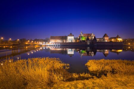 The Castle of the Teutonic Order in Malbork at dusk, Polandのeditorial素材