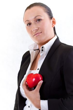Woman holding heart as a love symbolの写真素材