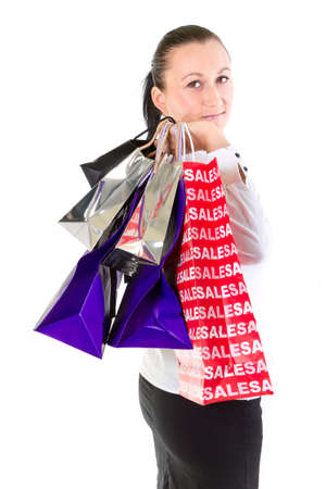 Woman holding shopping bags against white backgroundの写真素材