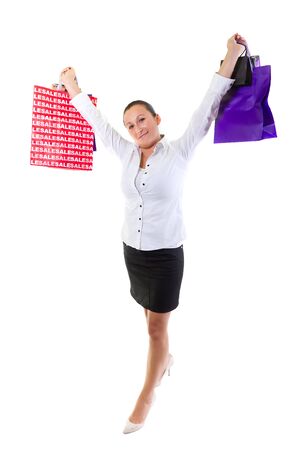 Woman holding shopping bags against white backgroundの写真素材