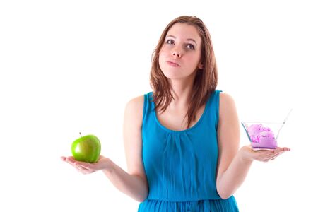 Healthy choice between an apple and ice creamの写真素材