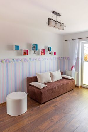 Bright baby room with pastel colour wallpaperの写真素材