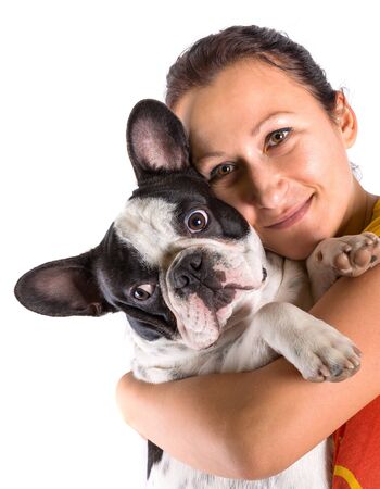 Beautiful woman hugging french bulldog puppyの写真素材