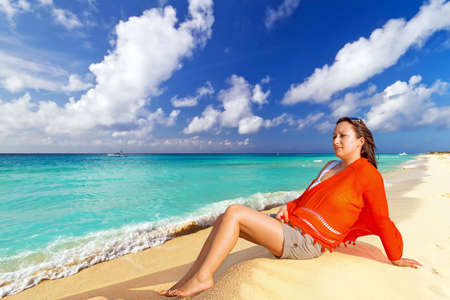 Woman posing on the beachの写真素材