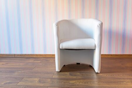 Single-seated armchair in bright baby roomの写真素材
