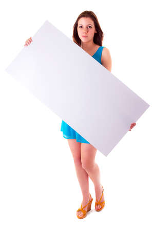 Beautiful brunette holding an empty white boardの写真素材