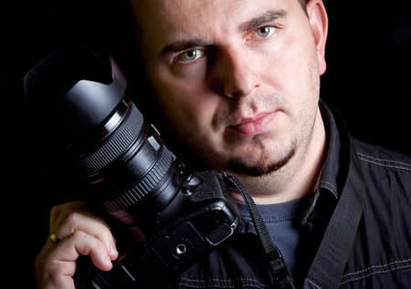 Photographer holding digital cameraの写真素材