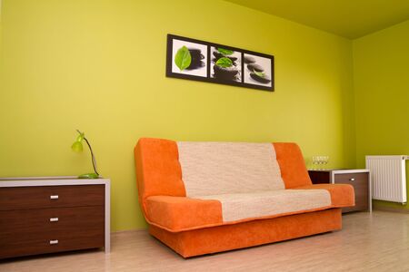 Orange sofa in modern room settingの写真素材
