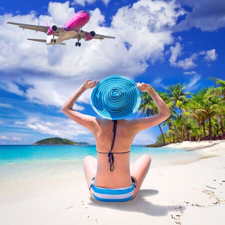 Woman enjoying the sun by the beachの写真素材