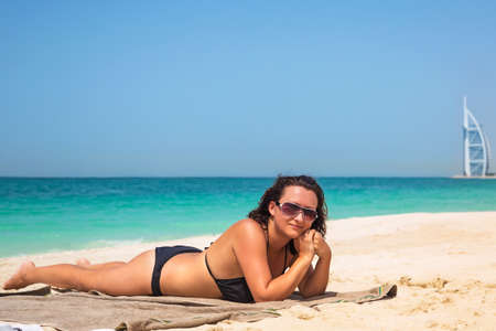 Woman relaxing on the beachの写真素材
