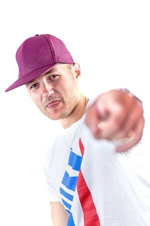 Man with cap pointing towards the cameraの写真素材