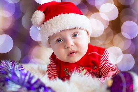 Baby boy in santa costume for Christmasの写真素材