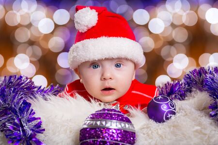 Baby boy in santa costume for Christmasの写真素材