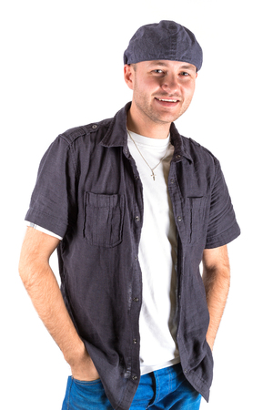 Portrait of young man in hat over whiteの写真素材
