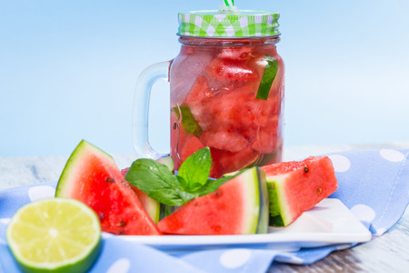 Watermelon and lime lemonades on kitchen tableの写真素材