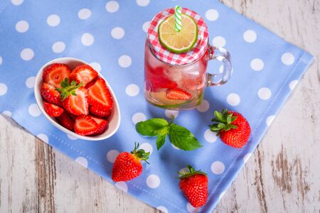 Summer strawberry lemonade in a jar glassの写真素材