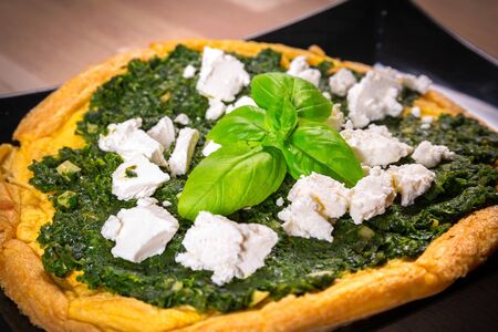 Delicious omelet with spinach and feta cheeseの写真素材
